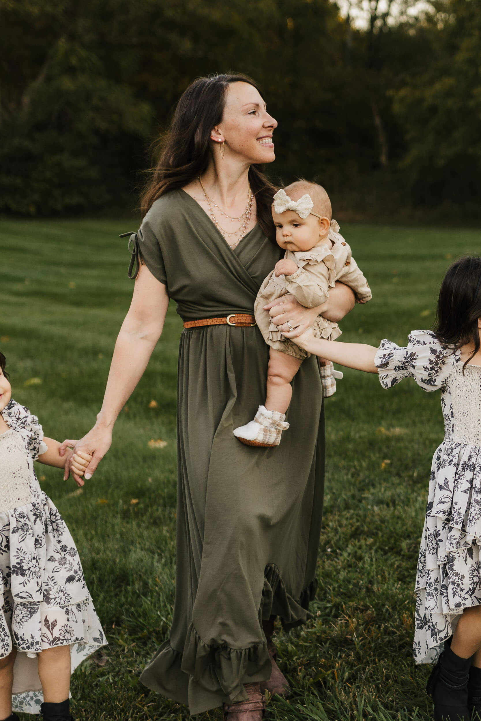 northern virginia family photographer mom walking 3 kids holding baby
