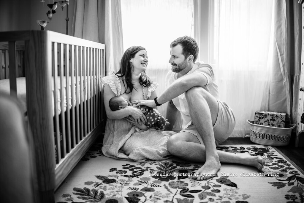 Black and white picture of new family of 3 at newborn session in Reston VA. 